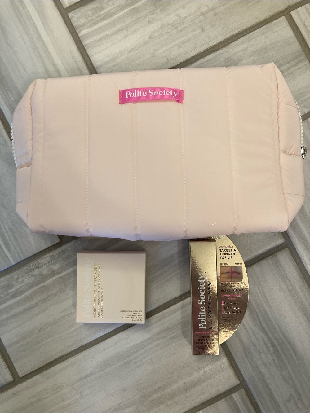 Polite Society lip plump, setting powder, and bag